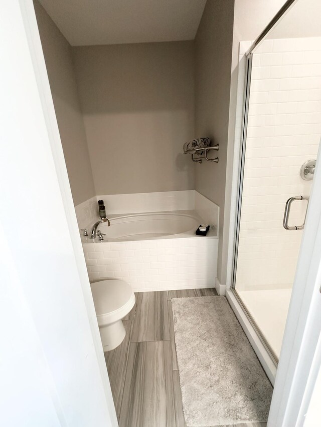 2743 W Lacewood Dr S, Taylorsville, UT 84129 - bathroom featuring toilet, a shower stall, and a garden tub