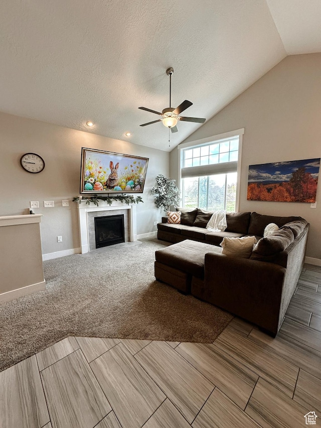 2743 W Lacewood Dr S, Taylorsville, UT 84129 - living room with baseboards, a ceiling fan, a fireplace, and lofted ceiling