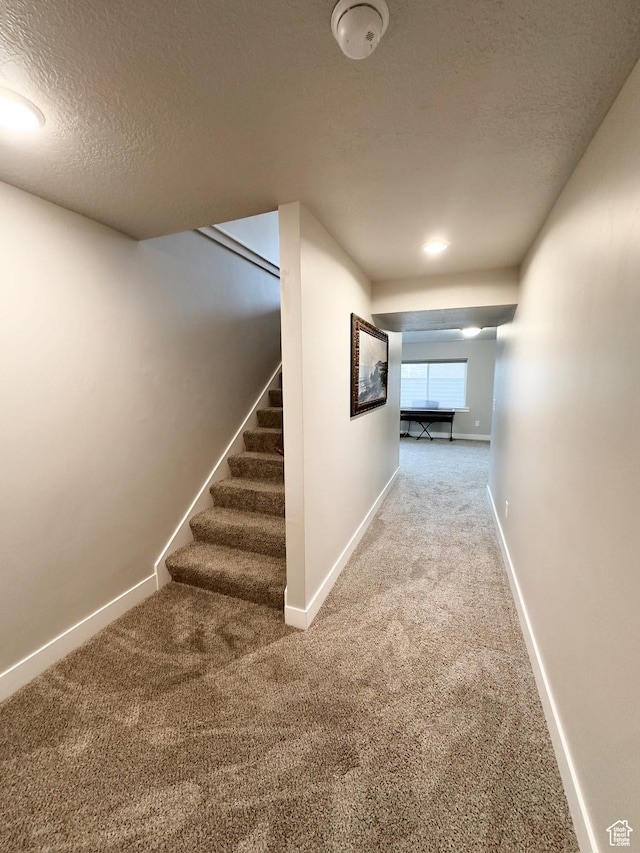 2743 W Lacewood Dr S, Taylorsville, UT 84129 - corridor featuring a textured ceiling, baseboards, stairs, and carpet floors
