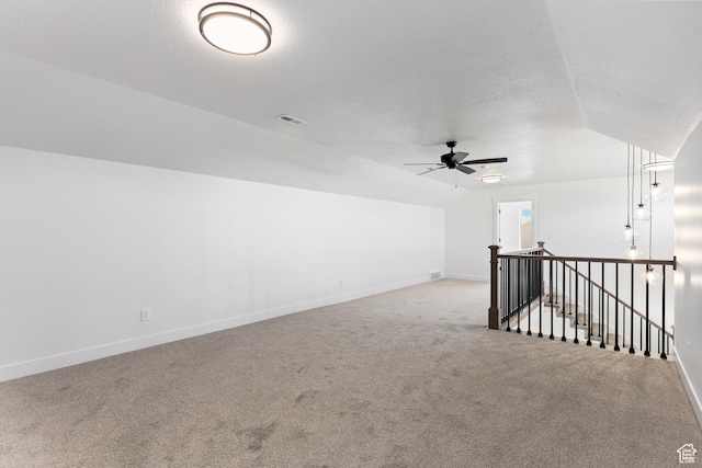 1107 S 4475 W, West Point, UT 84015 - unfurnished room featuring vaulted ceiling, carpet flooring, a ceiling fan, and a textured ceiling