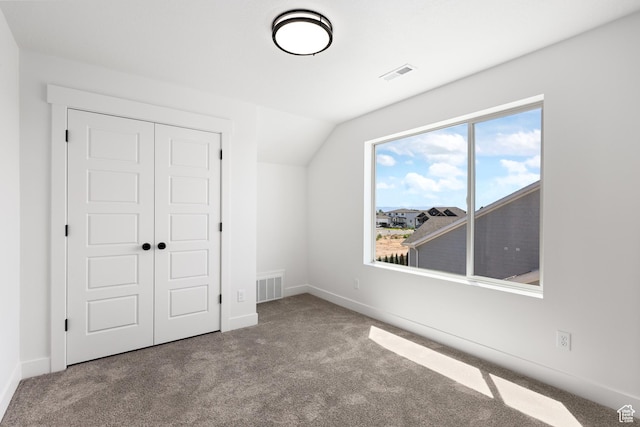 1107 S 4475 W, West Point, UT 84015 - unfurnished bedroom with carpet floors, a closet, and vaulted ceiling