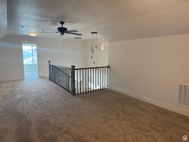1107 S 4475 W, West Point, UT 84015 - carpeted empty room featuring lofted ceiling, a textured ceiling, and a ceiling fan
