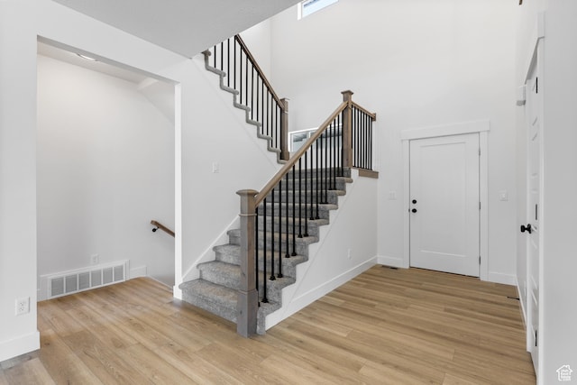1107 S 4475 W, West Point, UT 84015 - foyer entrance featuring wood finished floors, stairs, and a towering ceiling