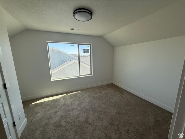 1107 S 4475 W, West Point, UT 84015 - additional living space with lofted ceiling, carpet, and a textured ceiling