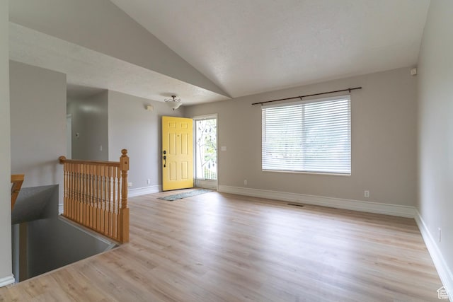 1608 W 8470 S, West Jordan, UT 84088 - empty room featuring visible vents, light wood-style flooring, lofted ceiling, and baseboards