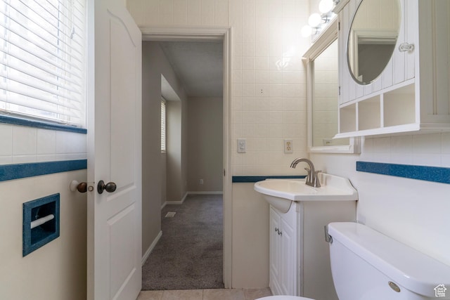 1608 W 8470 S, West Jordan, UT 84088 - half bath featuring tile walls, baseboards, toilet, and vanity