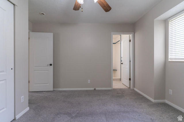 1608 W 8470 S, West Jordan, UT 84088 - unfurnished bedroom featuring ensuite bathroom, baseboards, a ceiling fan, and carpet floors