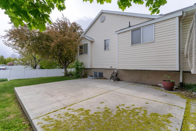 1608 W 8470 S, West Jordan, UT 84088 - back of property with fence, a lawn, and a patio