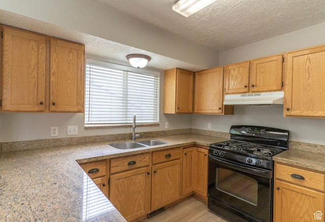 1608 W 8470 S, West Jordan, UT 84088 - kitchen featuring a textured ceiling, a sink, light countertops, under cabinet range hood, and black range with gas stovetop