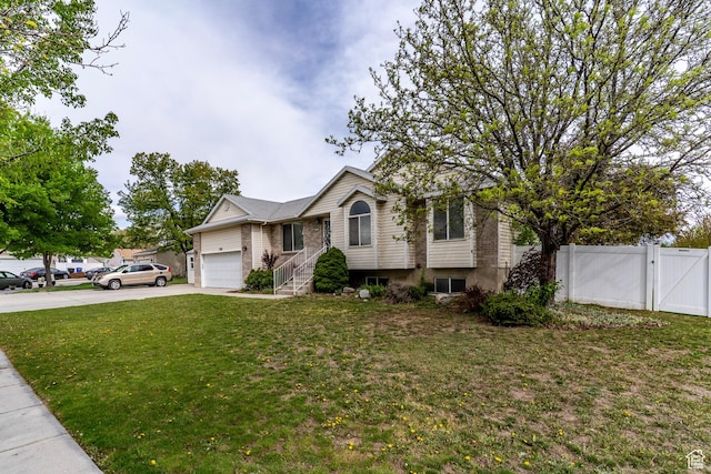 1608 W 8470 S, West Jordan, UT 84088 - view of front of house featuring a gate, fence, a garage, driveway, and a front yard