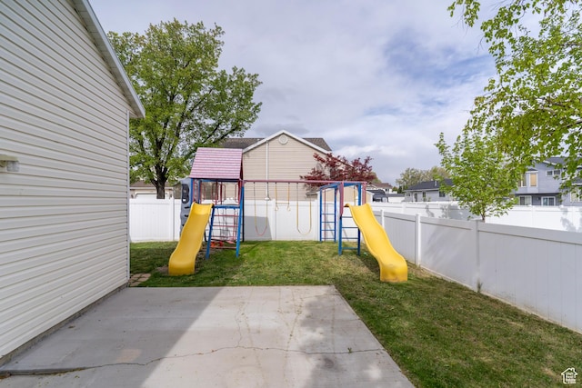 1608 W 8470 S, West Jordan, UT 84088 - view of jungle gym with a fenced backyard, a yard, and a patio area