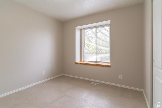 1608 W 8470 S, West Jordan, UT 84088 - unfurnished room with baseboards, visible vents, and light tile patterned flooring