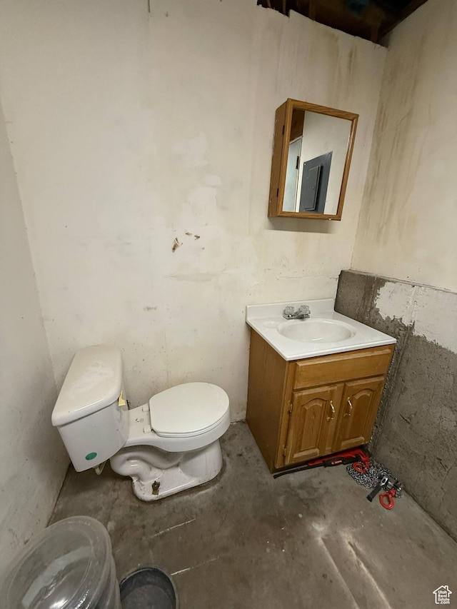 35 E 970 N, Castle Dale, UT 84513 - bathroom featuring toilet, unfinished concrete flooring, and vanity