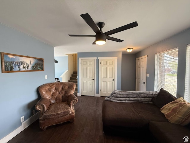 35 E 970 N, Castle Dale, UT 84513 - bedroom featuring multiple closets, a ceiling fan, dark wood-style floors, and baseboards