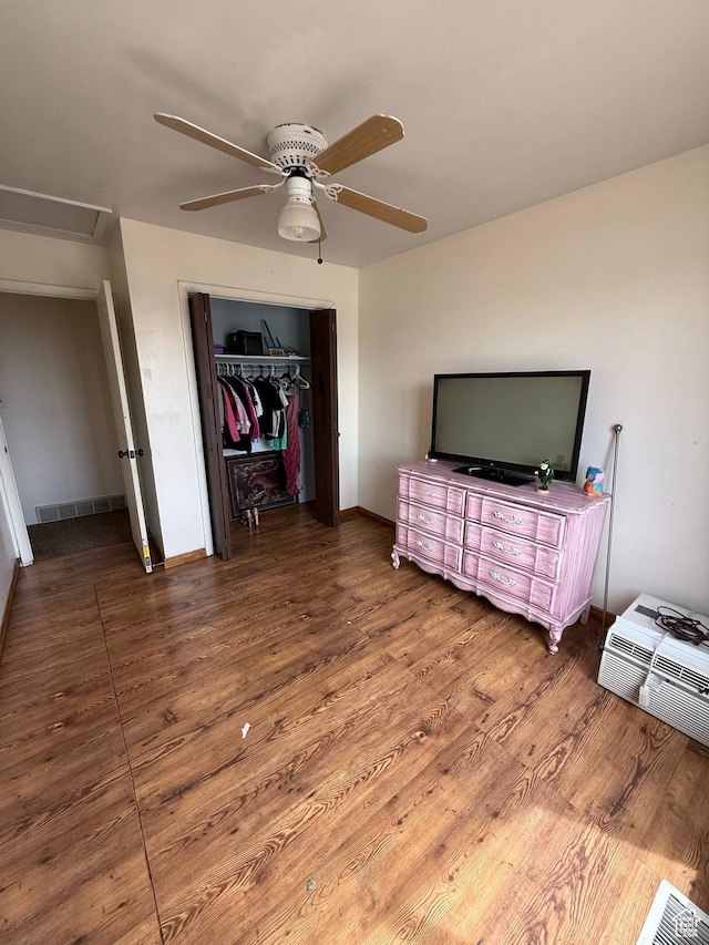 35 E 970 N, Castle Dale, UT 84513 - bedroom featuring wood finished floors, a closet, attic access, ceiling fan, and visible vents