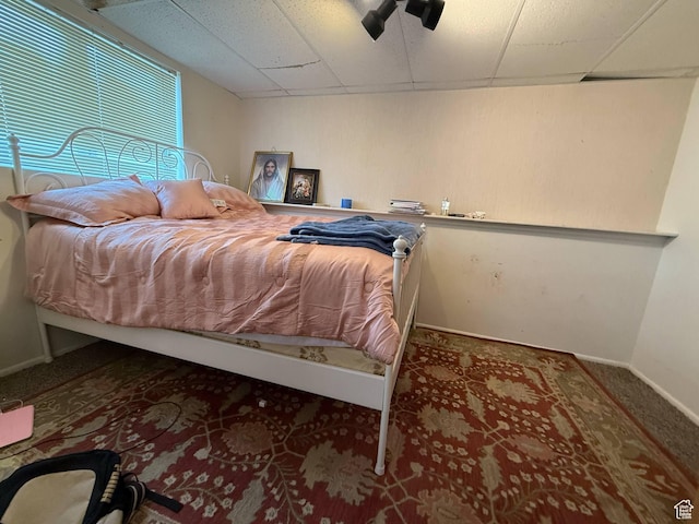 35 E 970 N, Castle Dale, UT 84513 - carpeted bedroom featuring baseboards, a ceiling fan, and a drop ceiling