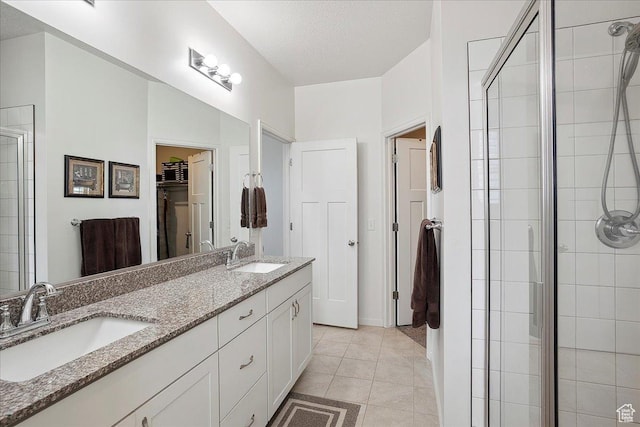 3339 W 650 N, Layton, UT 84041 - bathroom featuring a walk in closet, a stall shower, and a sink