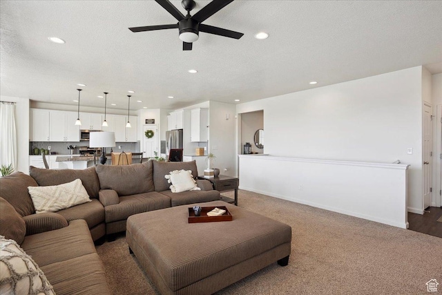 3339 W 650 N, Layton, UT 84041 - carpeted living area featuring baseboards, recessed lighting, a ceiling fan, and a textured ceiling