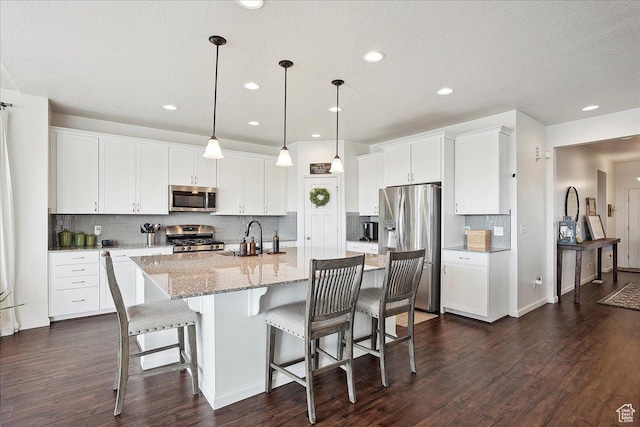 3339 W 650 N, Layton, UT 84041 - kitchen with tasteful backsplash, a sink, appliances with stainless steel finishes, dark wood-style flooring, and recessed lighting