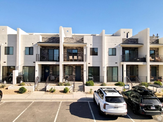 5399 S Cerulean Ln Unit 98, St George, UT 84790 - view of building exterior featuring uncovered parking