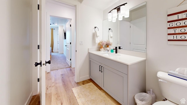 5399 S Cerulean Ln Unit 98, St George, UT 84790 - bathroom featuring toilet, wood finished floors, and vanity