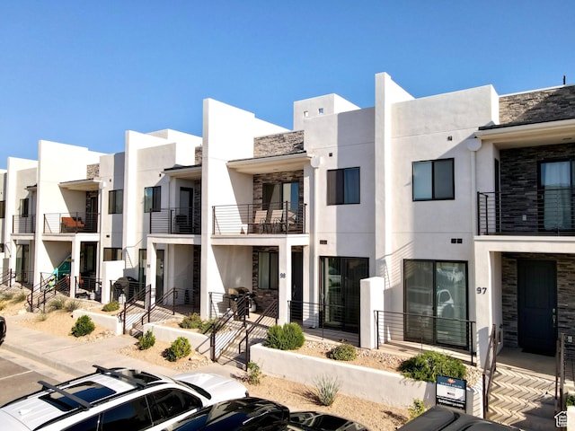 5399 S Cerulean Ln Unit 98, St George, UT 84790 - view of building exterior with uncovered parking