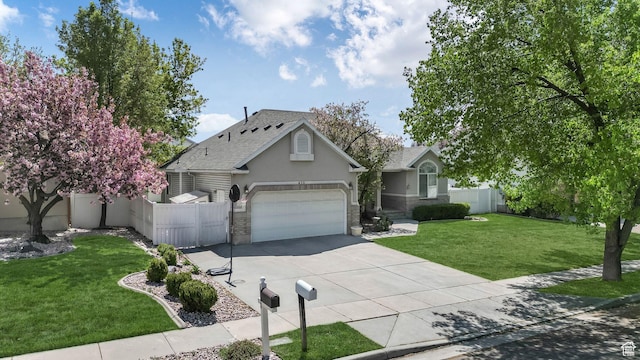 450 E Waterford Way, Midvale, UT 84047 - single story home with fence, stucco siding, driveway, and a front yard