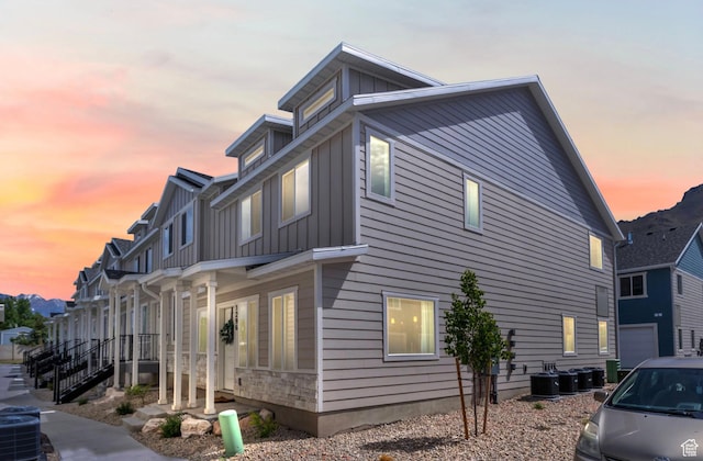 1296 S 1050 E, Provo, UT 84606 - property exterior at dusk with board and batten siding and central AC unit