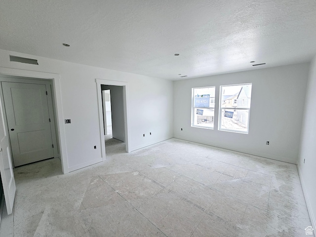 2814 W 2705 N Unit 89, Plain City, UT 84404 - spare room with a textured ceiling and baseboards