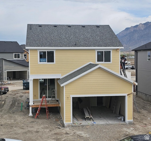 2814 W 2705 N Unit 89, Plain City, UT 84404 - back of house with a garage, a mountain view, and a shingled roof