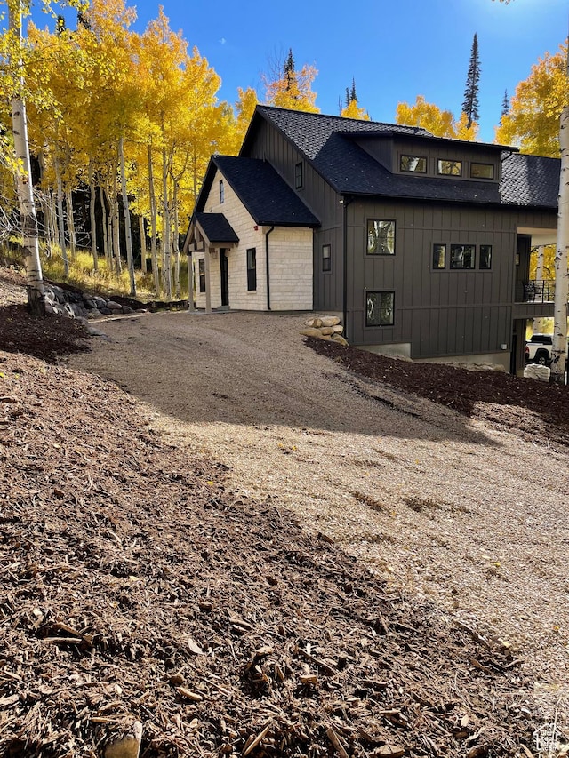4460 Fawn Way Unit 2039, Heber City, UT 84032 - exterior space with board and batten siding, an attached garage, driveway, and a shingled roof