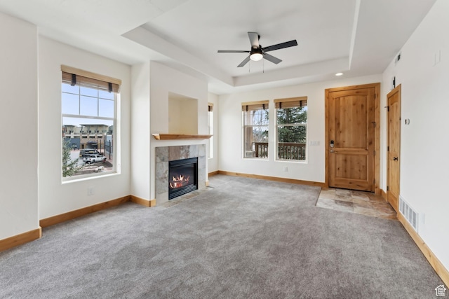 1541 Redstone Ave Unit C, Park City, UT 84098 - unfurnished living room featuring carpet, a raised ceiling, ceiling fan, and a wealth of natural light