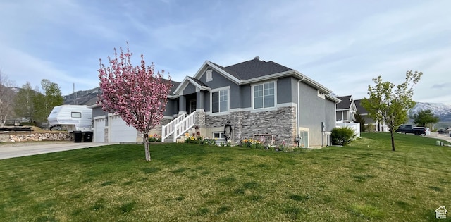864 E 180 N, Salem, UT 84653 - view of front facade with driveway, stone siding, a front yard, stucco siding, and a garage