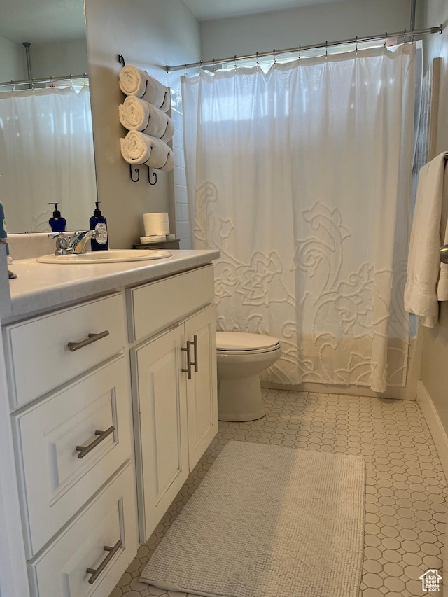 864 E 180 N, Salem, UT 84653 - full bath featuring tile patterned floors, shower / bath combo with shower curtain, toilet, and vanity