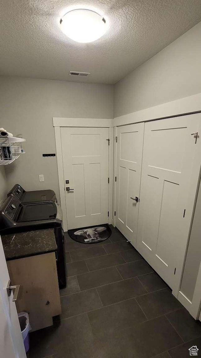 1016 N Vista Loop, Morgan, UT 84050 - laundry room with independent washer and dryer, a textured ceiling, laundry area, and dark tile patterned flooring