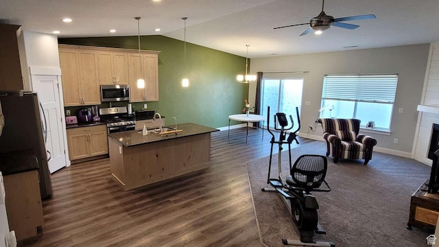 1016 N Vista Loop, Morgan, UT 84050 - kitchen featuring dark wood-style flooring, dark countertops, stainless steel appliances, a ceiling fan, and lofted ceiling