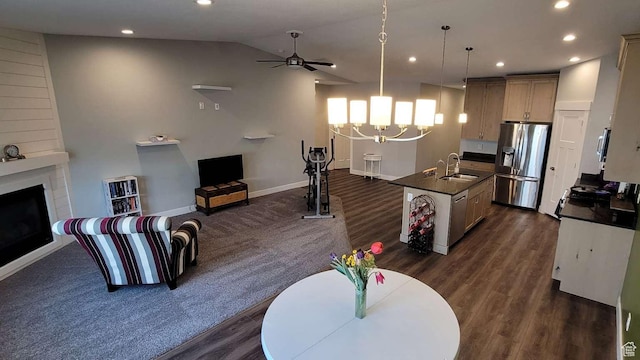 1016 N Vista Loop, Morgan, UT 84050 - living room with a fireplace, ceiling fan with notable chandelier, lofted ceiling, and dark wood-type flooring