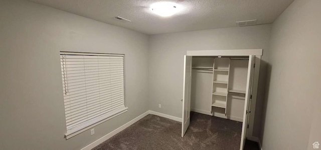 1016 N Vista Loop, Morgan, UT 84050 - unfurnished bedroom with a textured ceiling, visible vents, baseboards, a closet, and carpet flooring