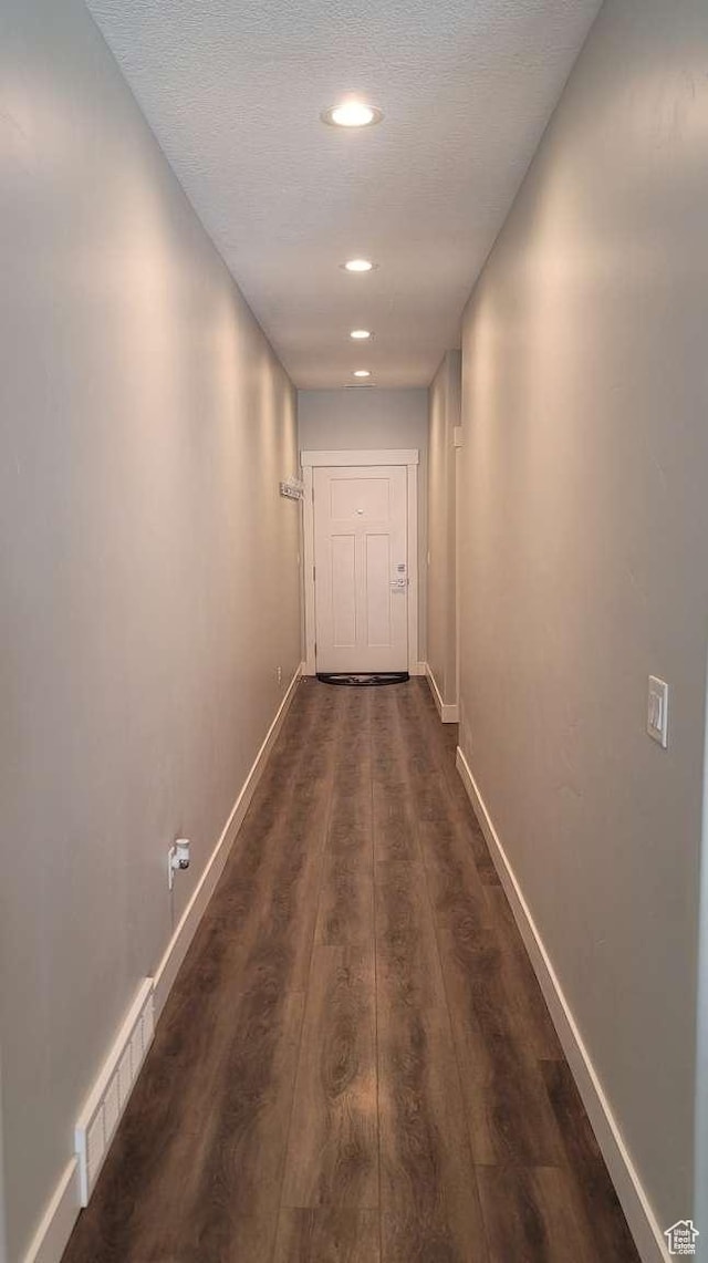 1016 N Vista Loop, Morgan, UT 84050 - hallway featuring a textured ceiling, recessed lighting, baseboards, visible vents, and dark wood-style floors