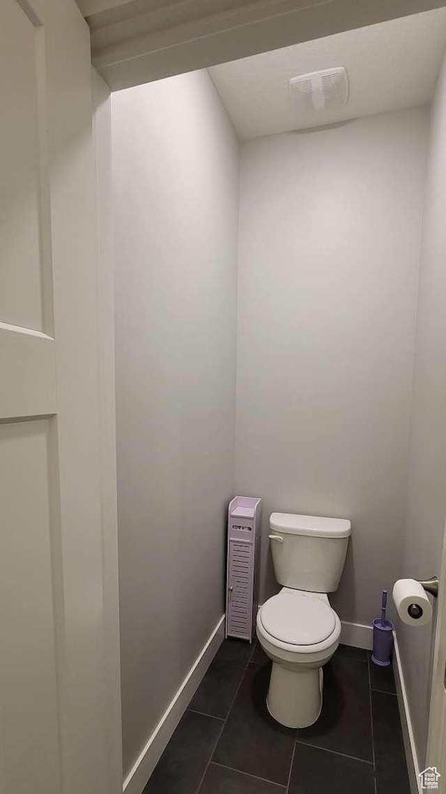 1016 N Vista Loop, Morgan, UT 84050 - bathroom with toilet, tile patterned floors, visible vents, and baseboards
