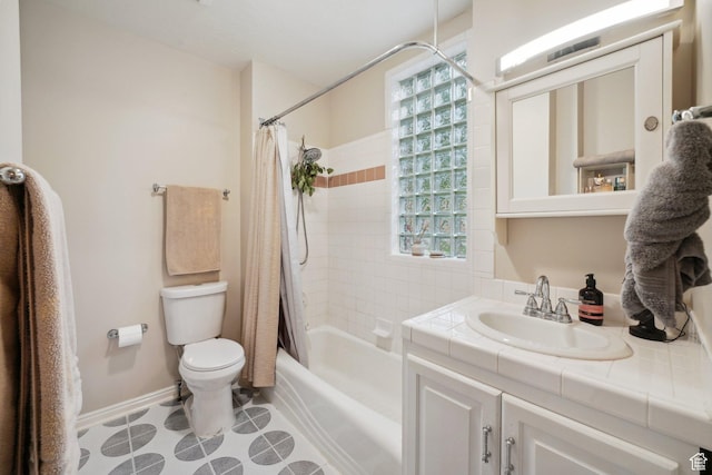 full bath featuring vanity, baseboards, toilet, and shower / bath combination with curtain