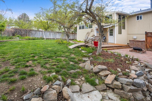 33 S Benchview Dr E, Tooele, UT 84074 - view of yard featuring a fenced backyard and a deck