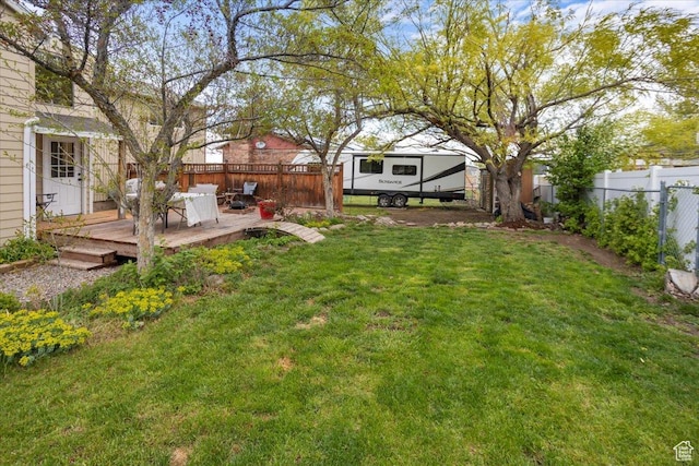 33 S Benchview Dr E, Tooele, UT 84074 - view of yard featuring a fenced backyard and a deck