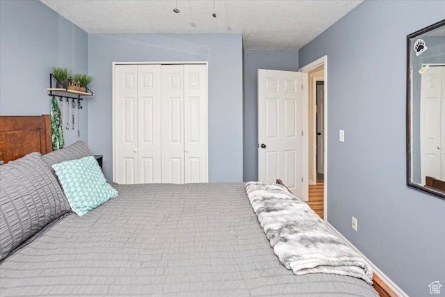 33 S Benchview Dr E, Tooele, UT 84074 - bedroom with a closet and a textured ceiling