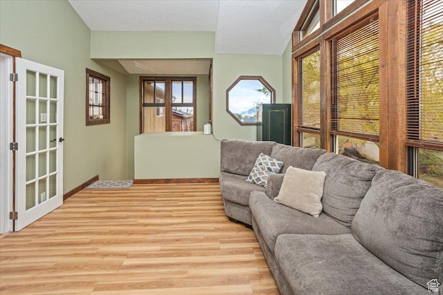 33 S Benchview Dr E, Tooele, UT 84074 - living area featuring baseboards, plenty of natural light, and light wood-style floors