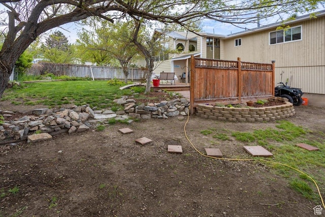 33 S Benchview Dr E, Tooele, UT 84074 - view of yard with a fenced backyard and a deck