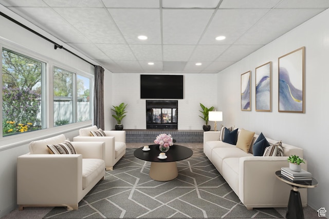 981 N 1300 W, Salt Lake City, UT 84116 - living room featuring a brick fireplace, recessed lighting, and a paneled ceiling