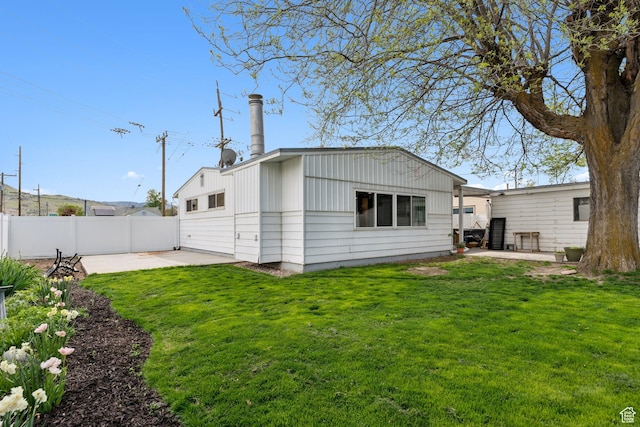 981 N 1300 W, Salt Lake City, UT 84116 - back of property featuring a yard, fence, and a patio area