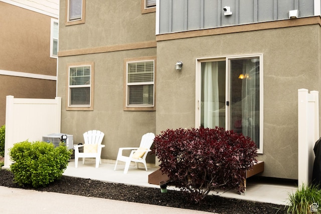 5229 W Armada Way, Herriman, UT 84096 - exterior space featuring fence, stucco siding, board and batten siding, a patio area, and central air condition unit