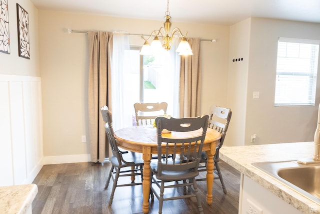 5229 W Armada Way, Herriman, UT 84096 - dining space with a notable chandelier, plenty of natural light, and dark wood finished floors